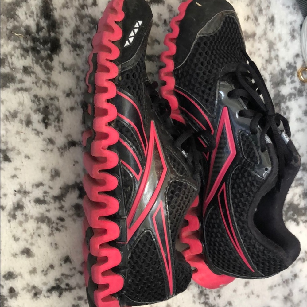 Black and red rebook athletic shoes
